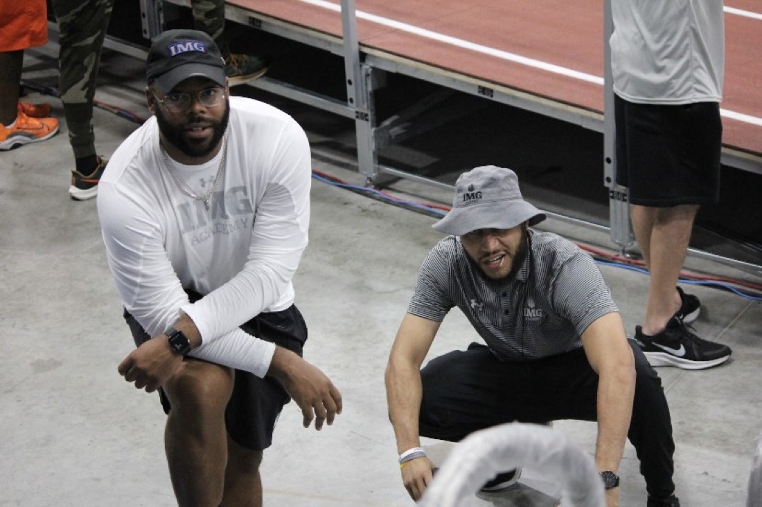 Markus Hawkins, left, courtside at IMG Academy